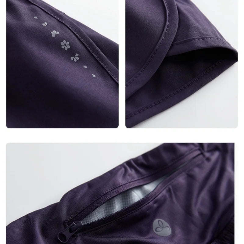 Close-up details of KiKis Womens Running Shorts in dark purple showing fabric texture, stitching, and zipper pocket