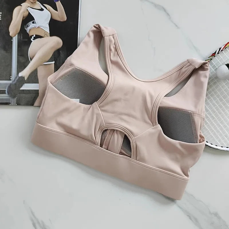 KiKis high impact front zipper sports bra in light pink with breathable mesh panels