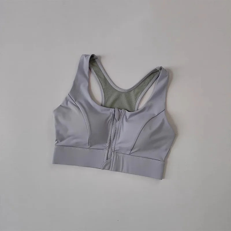 KiKis high impact front zipper sports bra in light gray with racerback design