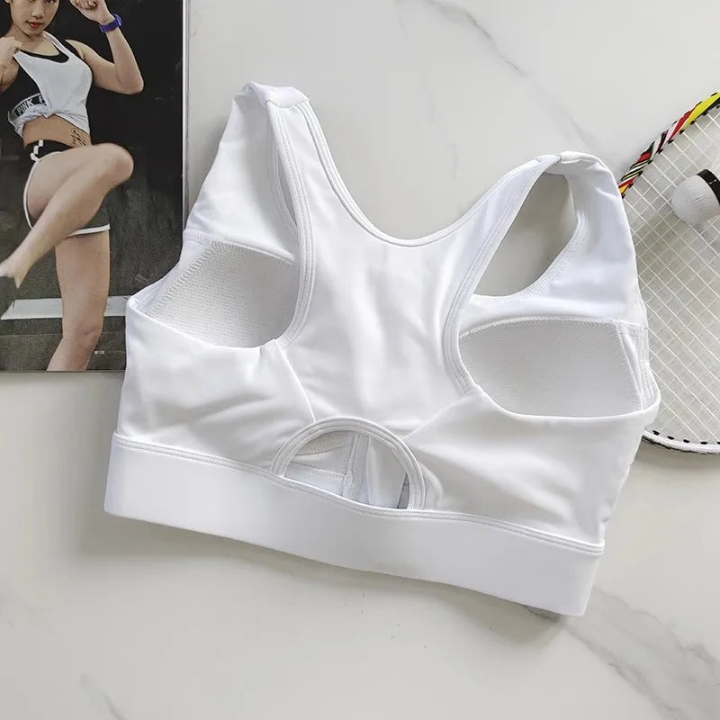 KiKis white high impact front zipper sports bra with mesh panels and racerback design