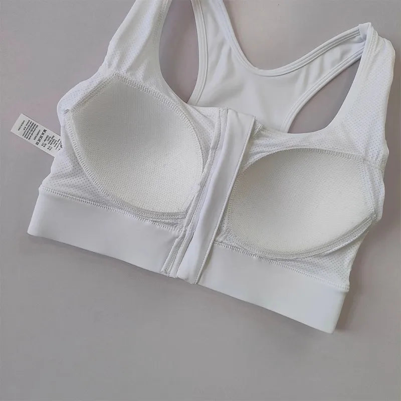 KiKis white high impact front zipper sports bra with mesh panels and racerback design