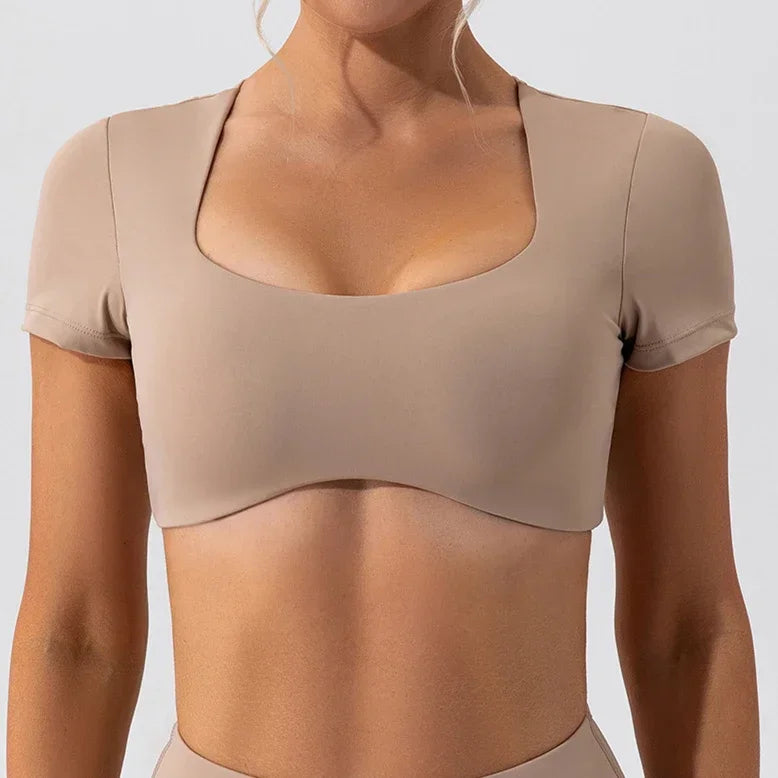 KiKis women's short sleeve sports crop top in beige with square neckline and fitted design