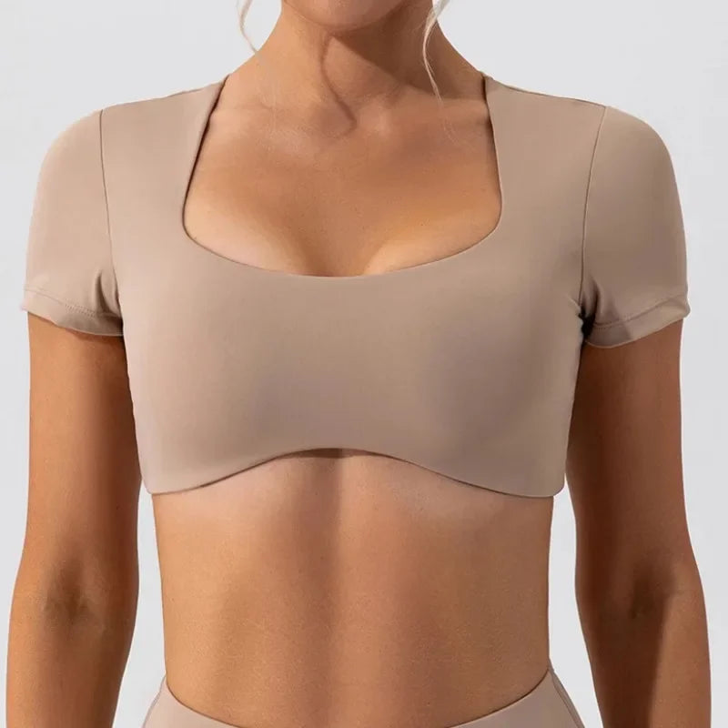 Beige women's short sleeve sports crop top with square neckline and fitted design by KiKis