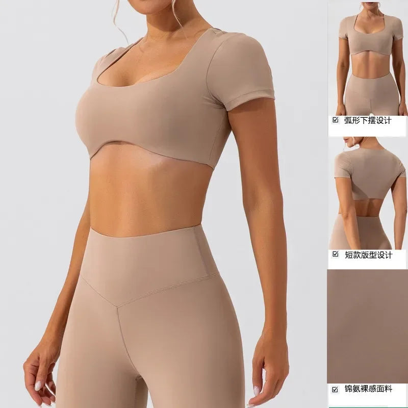 Beige women's short sleeve sports crop top by KiKis with matching high-waisted leggings on model