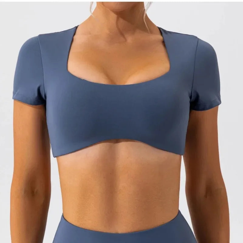 KiKis women's short sleeve sports crop top in blue with square neckline and fitted design
