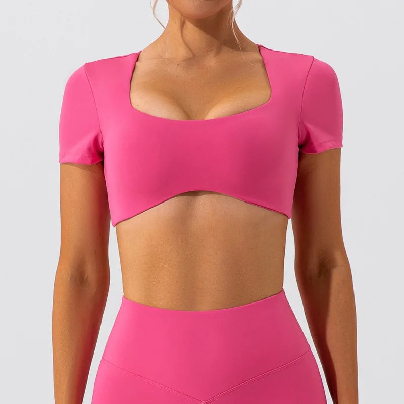 KiKis women's short sleeve sports crop top in bright pink with square neckline
