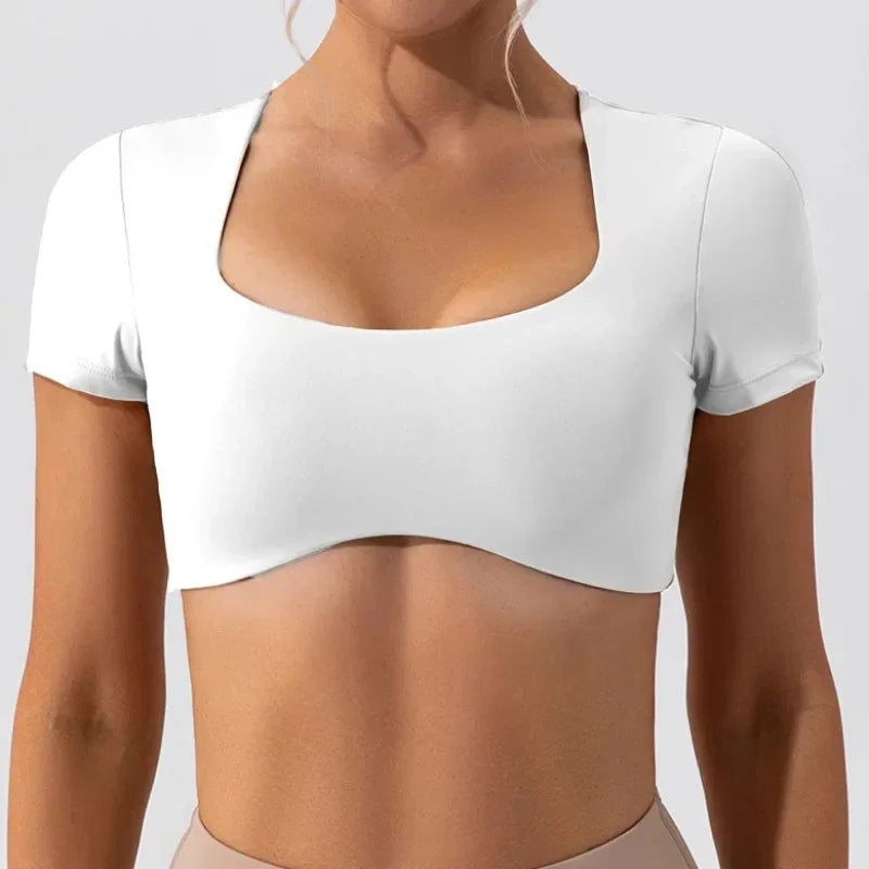KiKis white women's short sleeve sports crop top with square neckline and fitted design