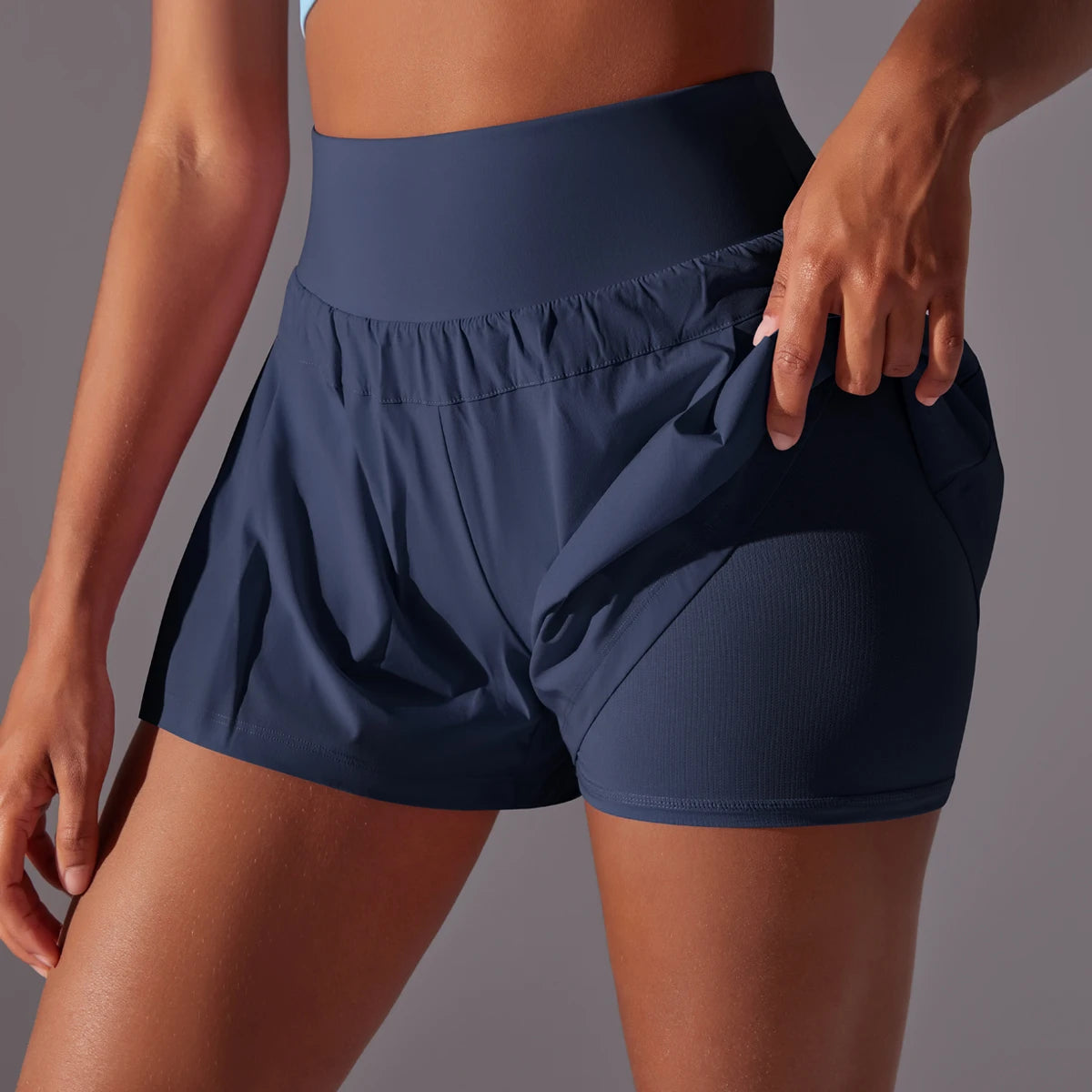 KiKis navy blue high waist women's gym shorts with side pockets and fitted inner lining