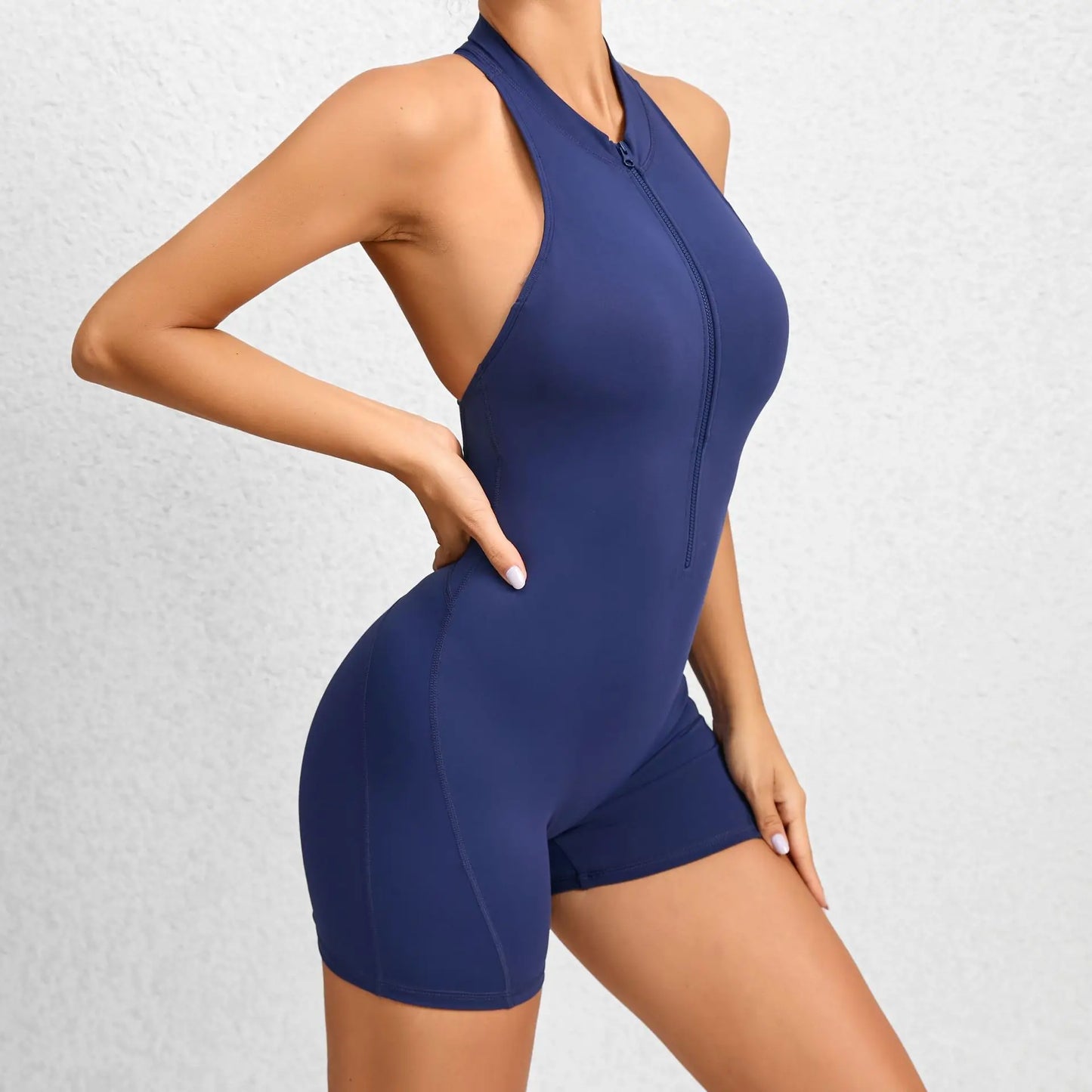 KiKis navy blue sleeveless workout romper with front zipper and racerback design