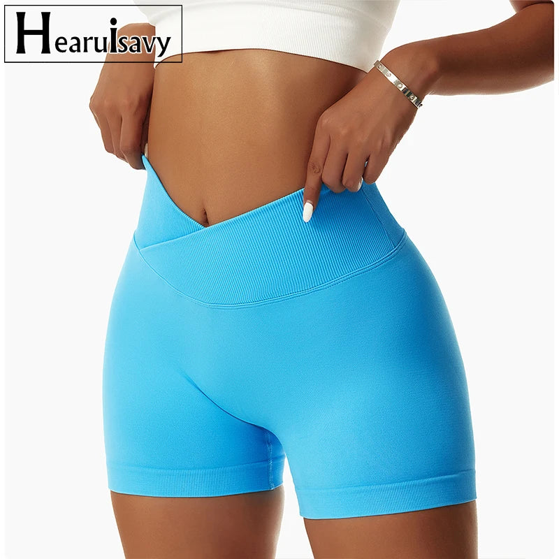 KiKis bright blue high waist seamless yoga shorts worn by woman with white crop top