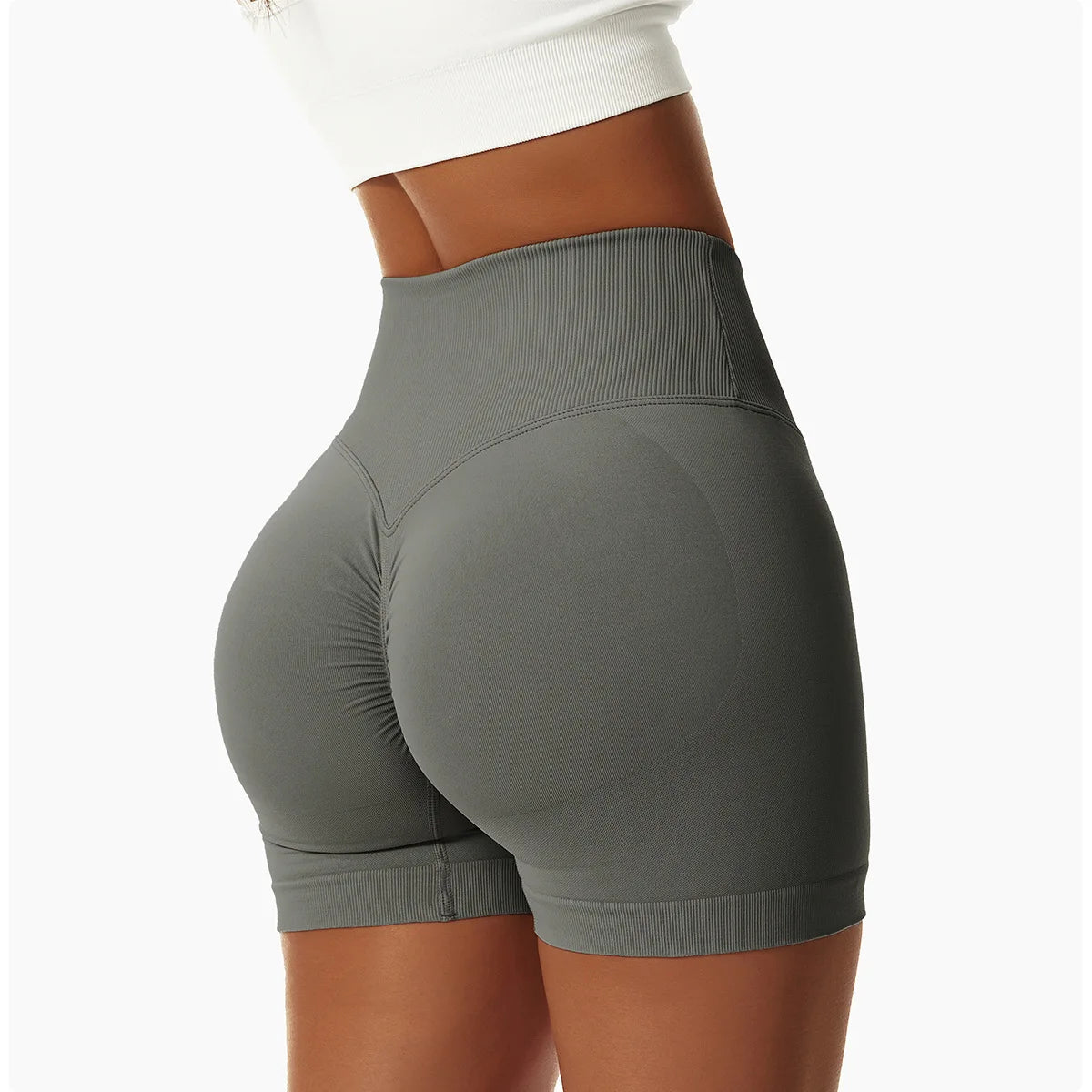 KiKis high waist seamless yoga shorts in gray on model highlighting fit and texture