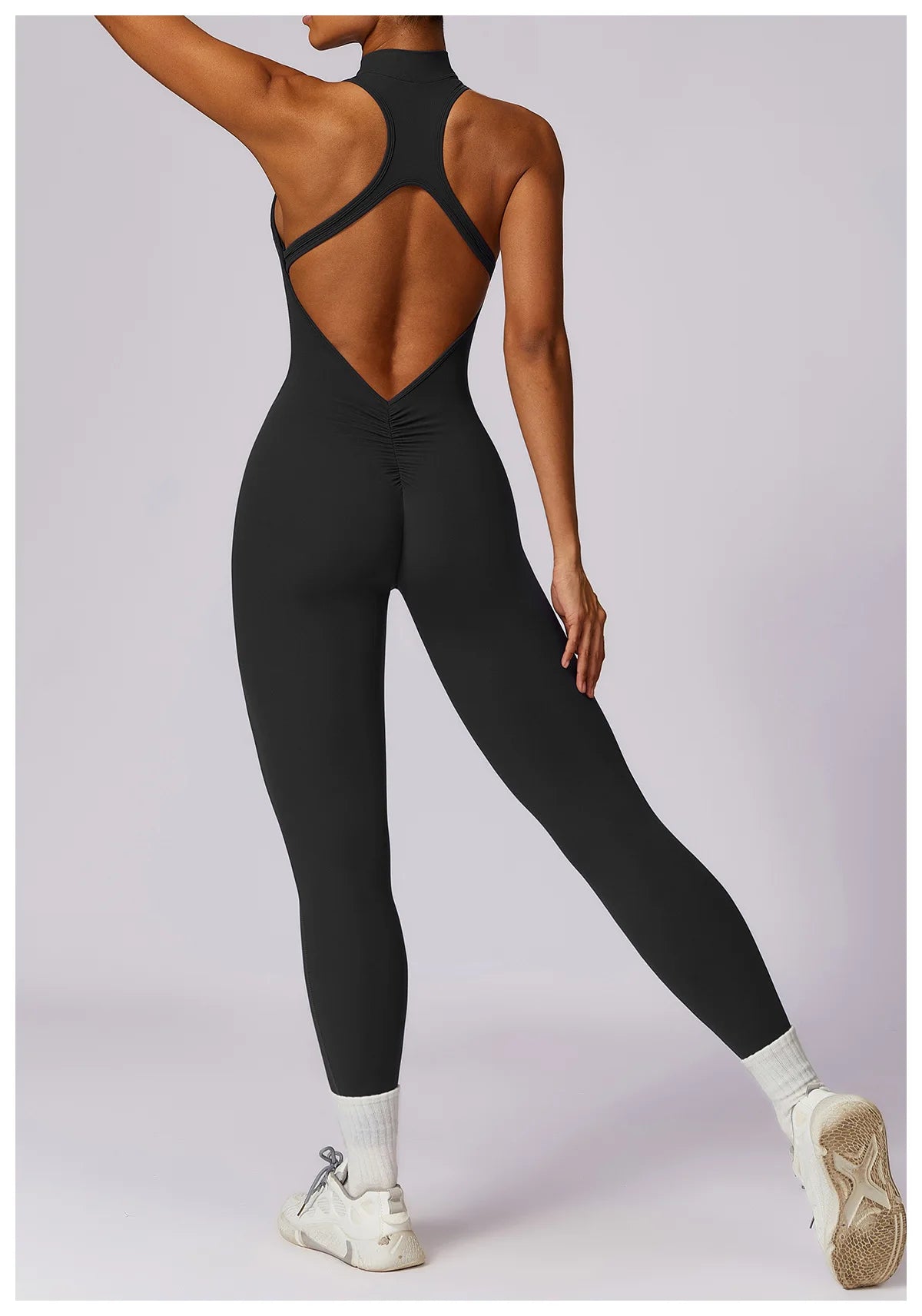 KiKis black v back one-piece yoga suit with open back and fitted full-length leggings