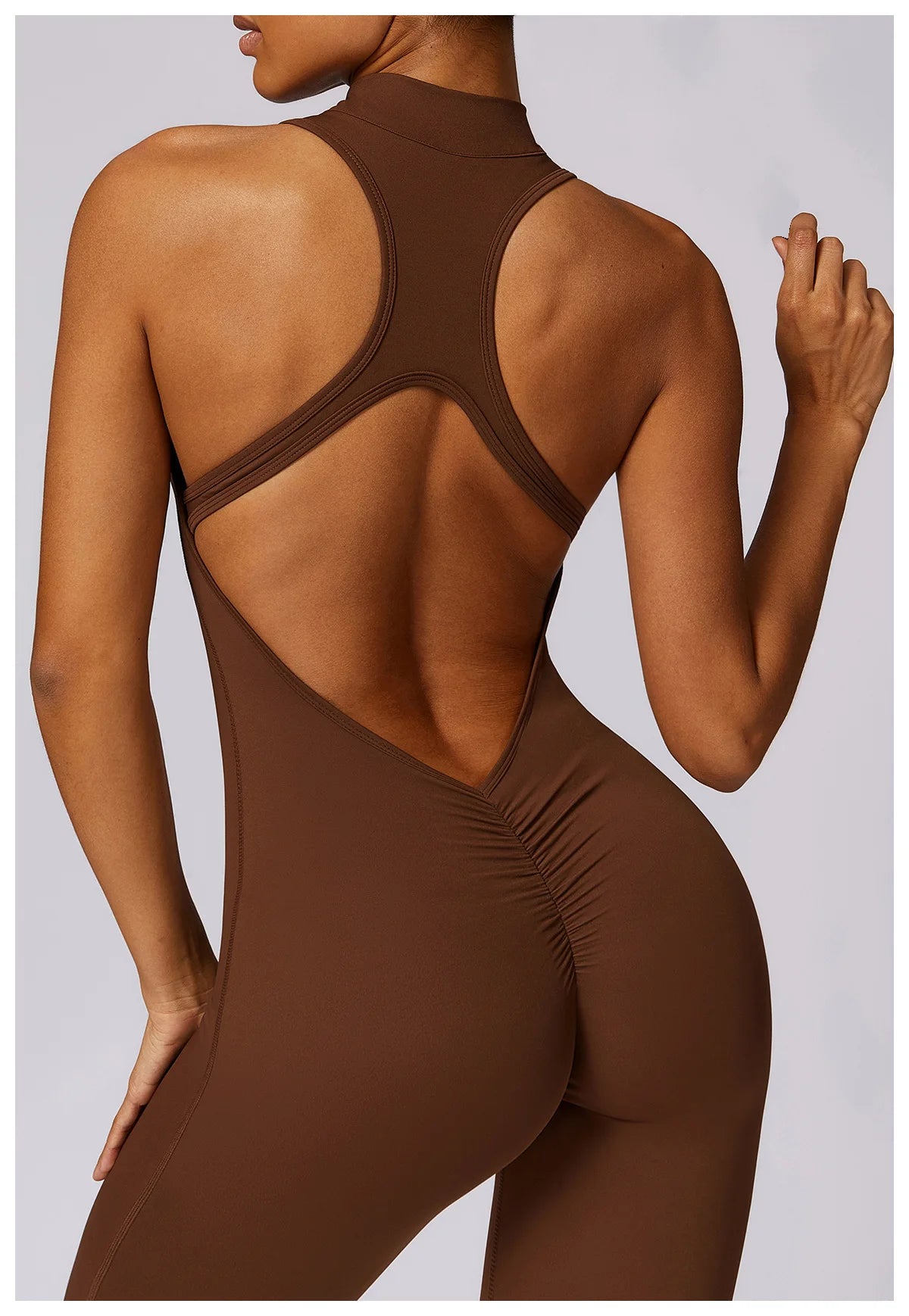 KiKis brown v back one-piece yoga suit with ruched detailing on the back and cutout design