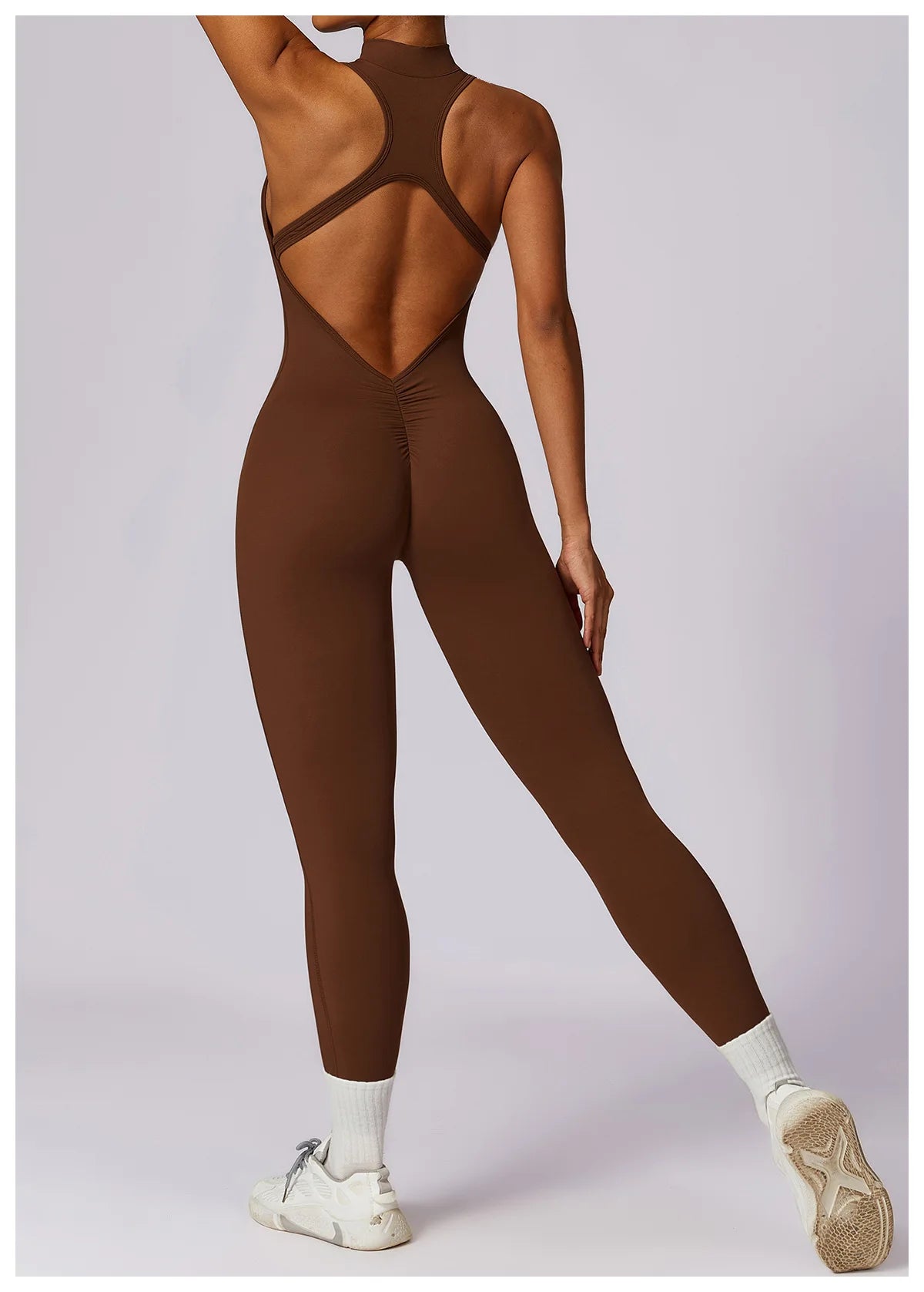 KiKis brown v back one-piece yoga suit with sleeveless design and full-length leggings