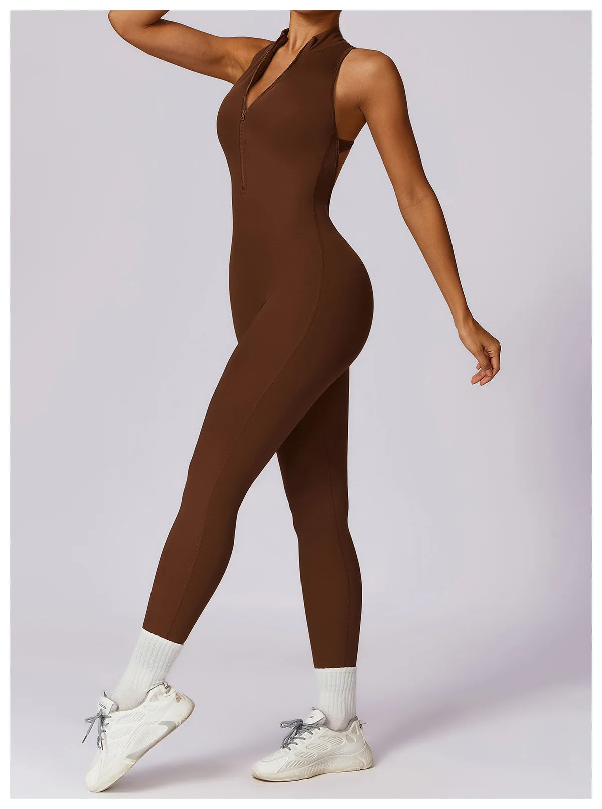 KiKis brown v back one-piece yoga suit worn with white sneakers and socks