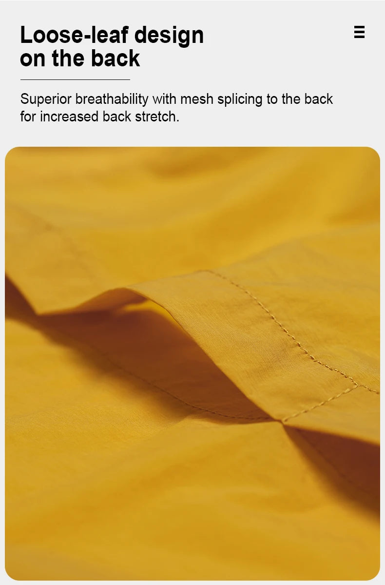 Close-up of yellow fabric with loose-leaf design on the back of women's cycling windbreaker by KiKis