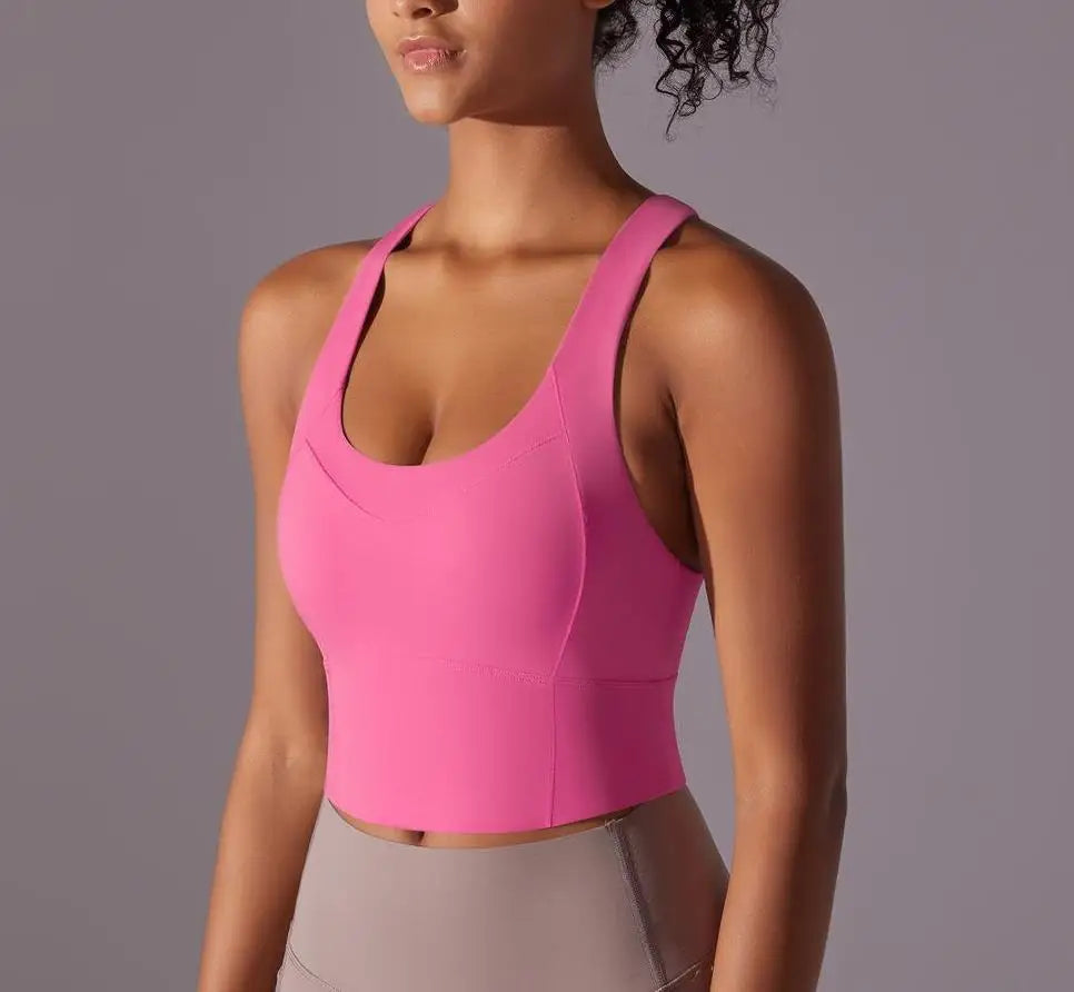 KiKis seamless crossback sports bra for women in bright pink with supportive fit