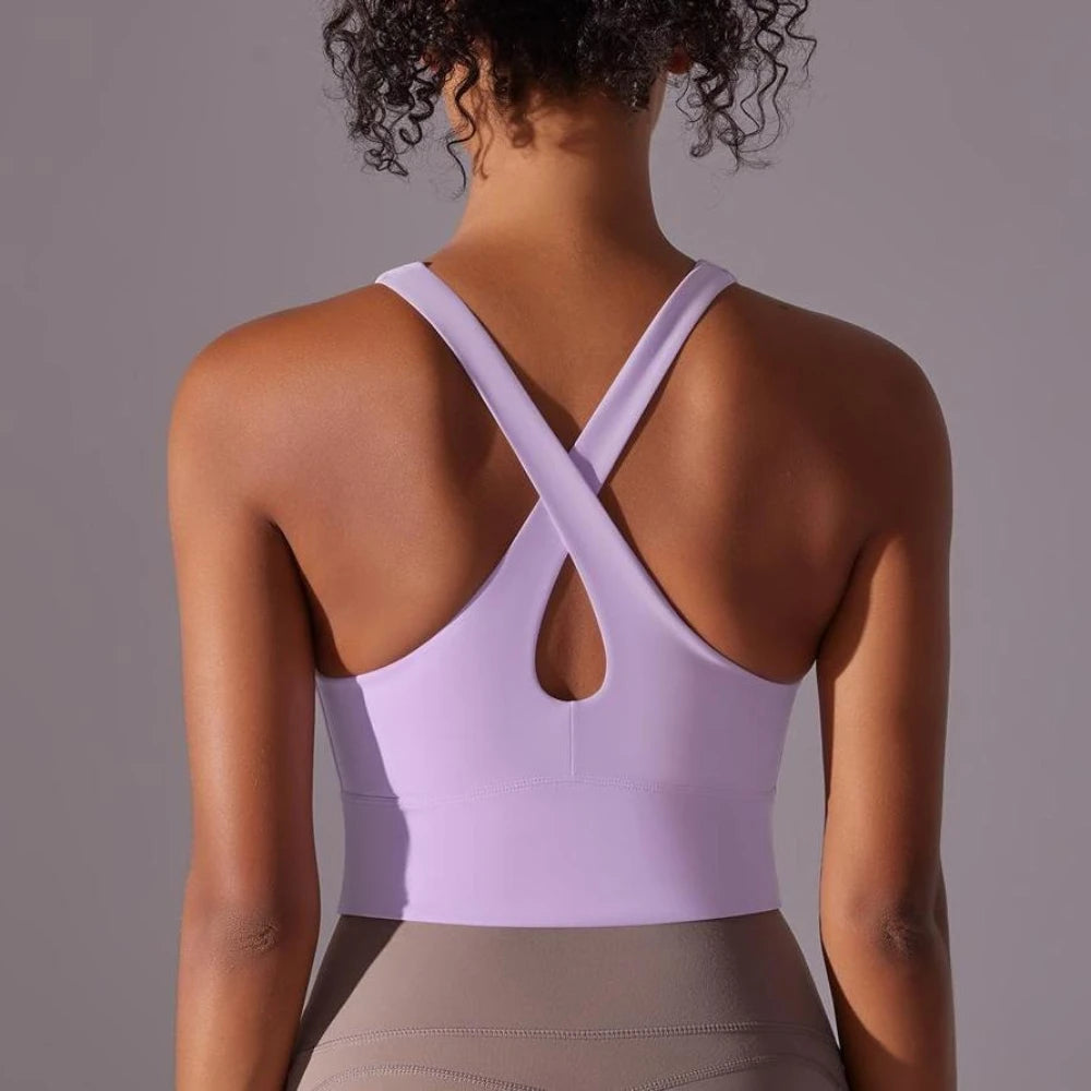 Back view of seamless crossback sports bra for women in lavender color by KiKis