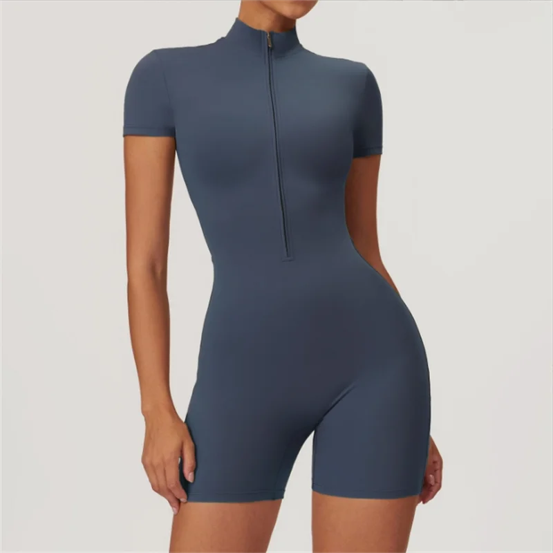 KiKis fitted short sleeve jumpsuit with front zipper in navy blue, styled female model standing