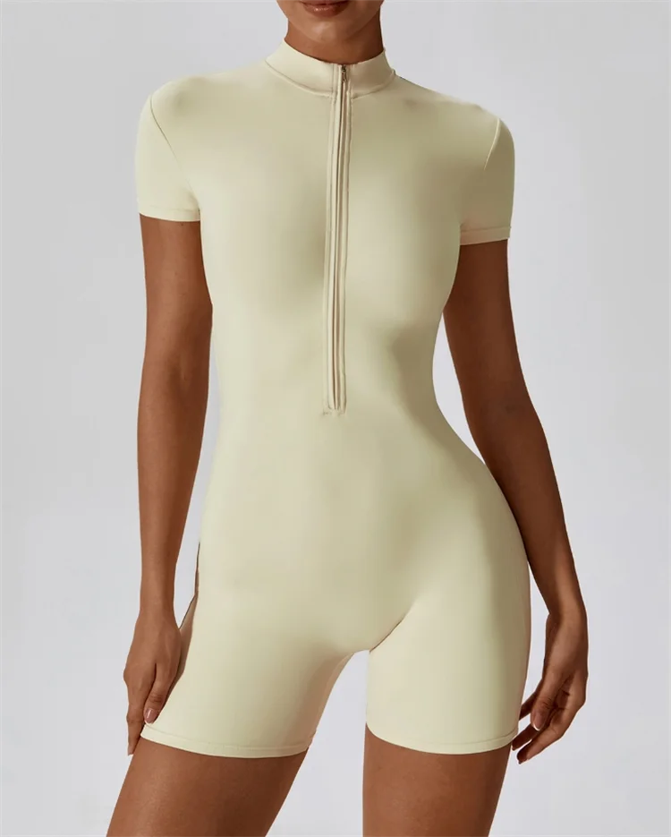 KiKis nude one-piece yoga jumpsuit with short sleeves and front zipper for activewear