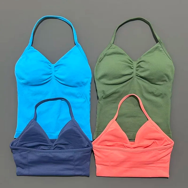 KiKis open back yoga tank top for women in blue green navy and coral colors laid flat