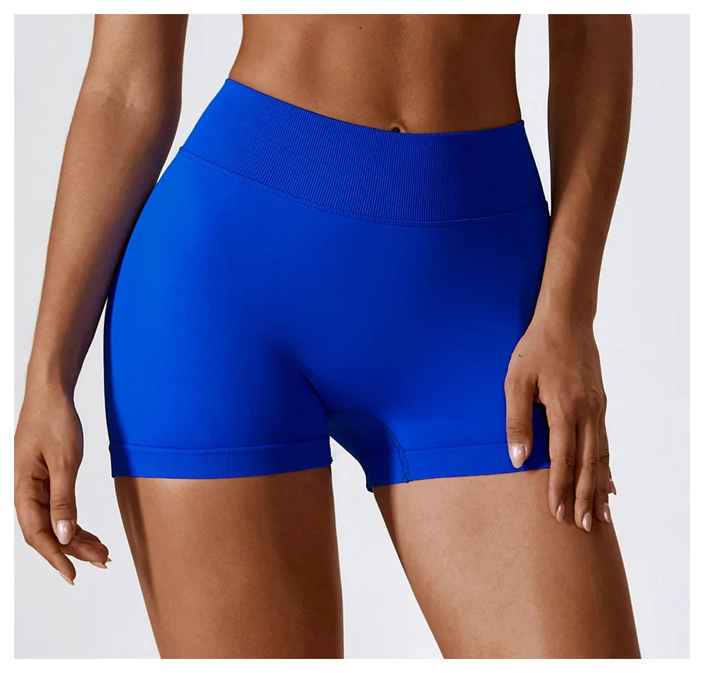 KiKis seamless scrunch butt gym shorts in vibrant blue worn by model showing fit and stretch