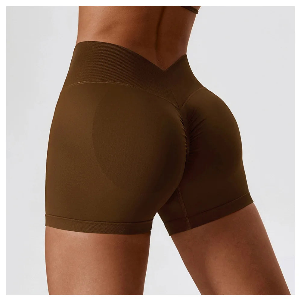 KiKis seamless scrunch butt gym shorts in brown highlighting contour and fit