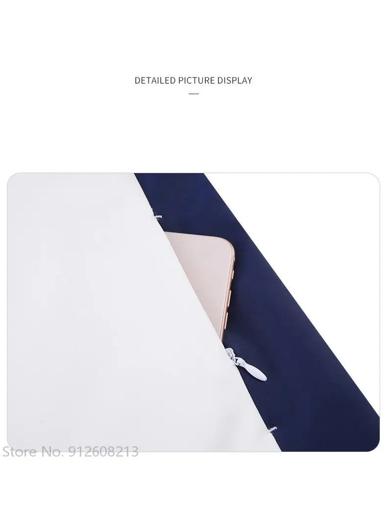 Close-up of navy and white women's golf windbreaker jacket zipper detail with phone in pocket