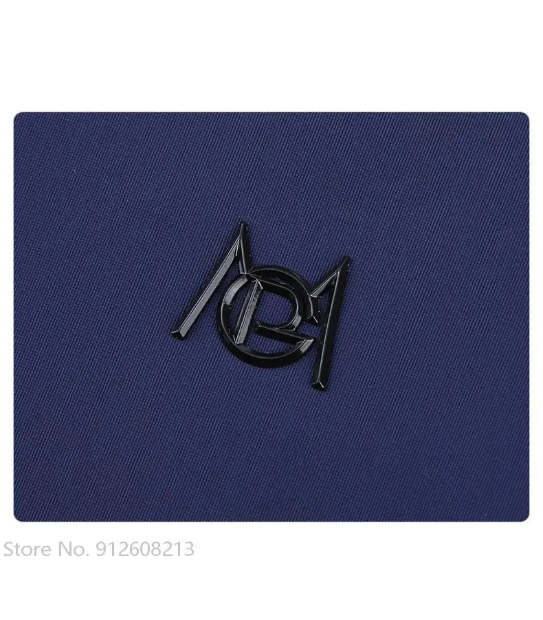 Close-up of KiKis logo on navy fabric of women's golf windbreaker jacket