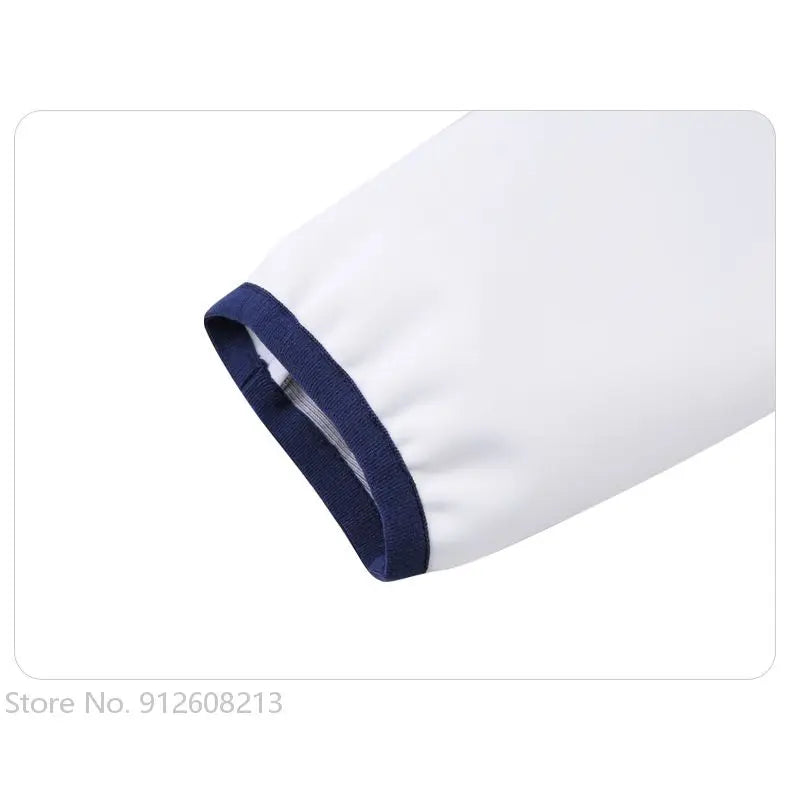 Close-up of white sleeve with navy trim of women's golf windbreaker jacket by KiKis