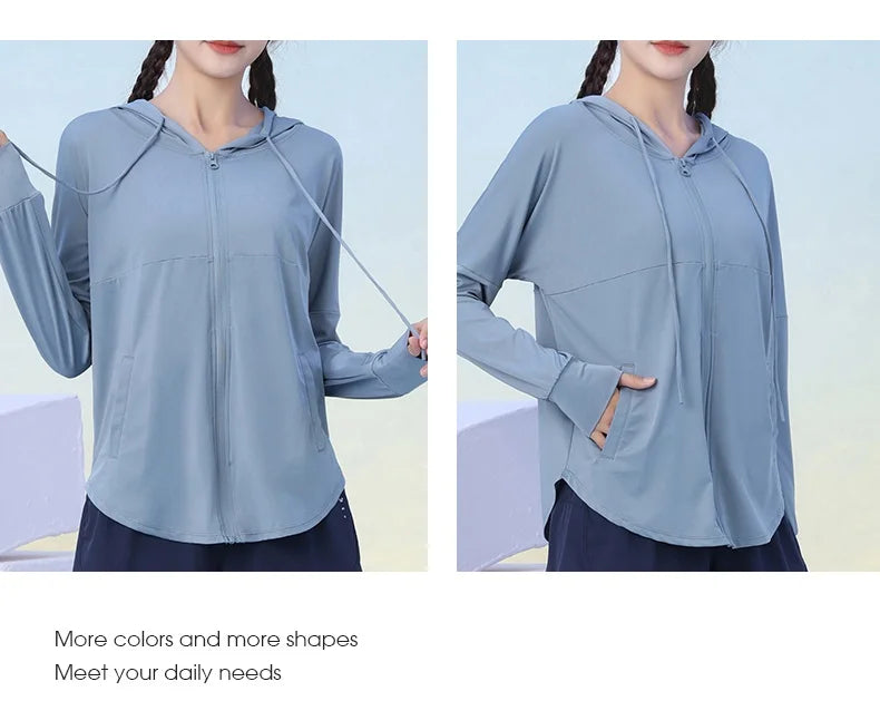 KiKis light blue long sleeve hooded zip-up jacket with thumb holes and front pockets