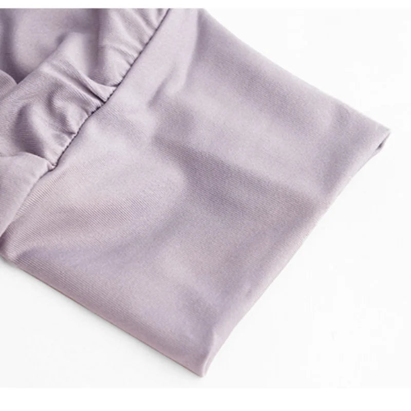 Close-up of light purple fabric with elastic gathering detail from KiKis