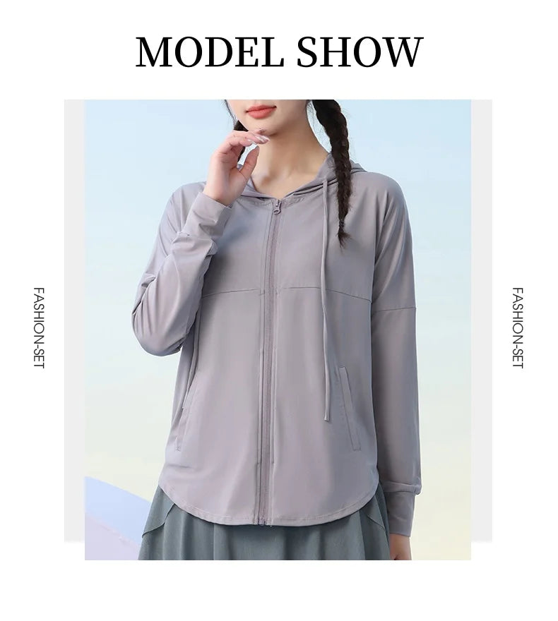 KiKis lightweight gray zip-up hoodie with hood and front pockets modeled by woman