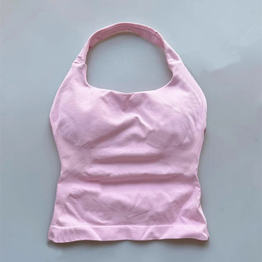 KiKis seamless backless sports tank top in light pink with a halter neck design