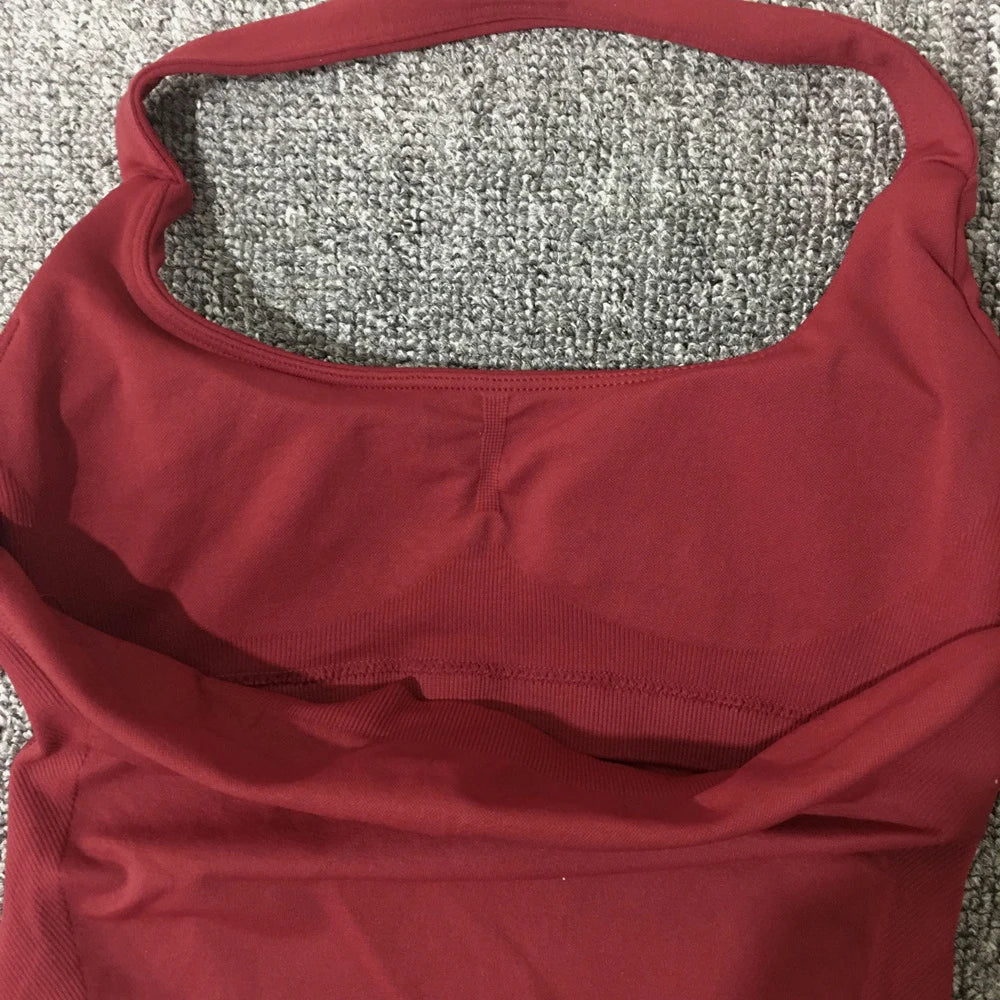 KiKis seamless backless sports tank top in red with smooth stretch fabric and halter neckline