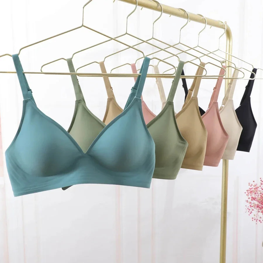 KiKis seamless push up bra for women in multiple colors hanging on gold hangers
