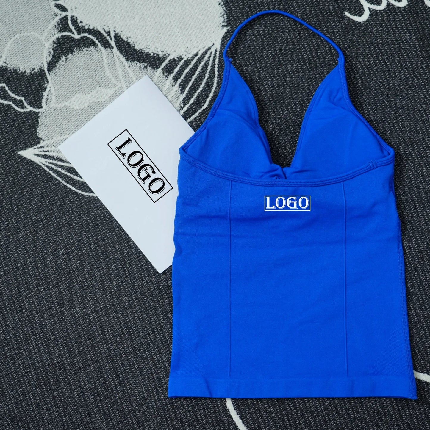 KiKis seamless yoga sports bra in bright blue with thin straps and logo patch on front