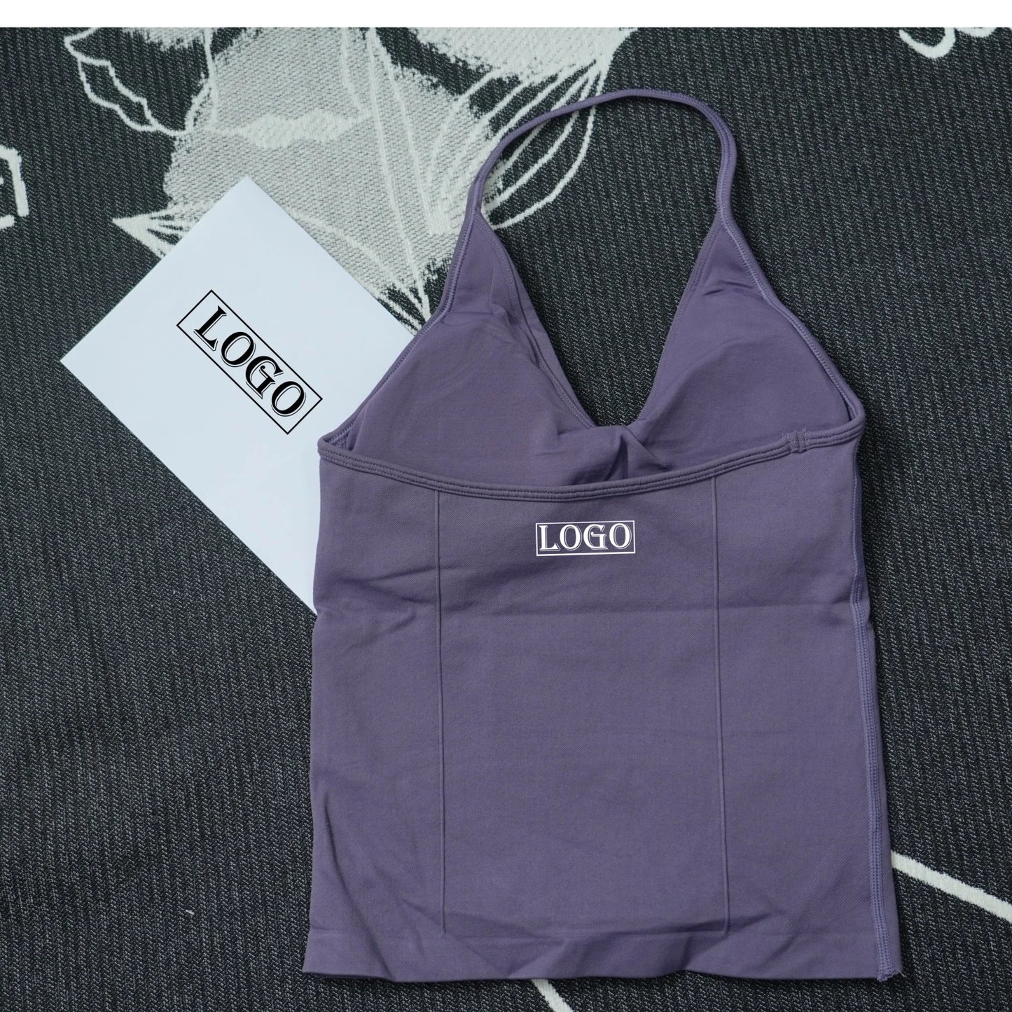 KiKis seamless yoga sports bra in purple with thin straps and smooth fabric texture