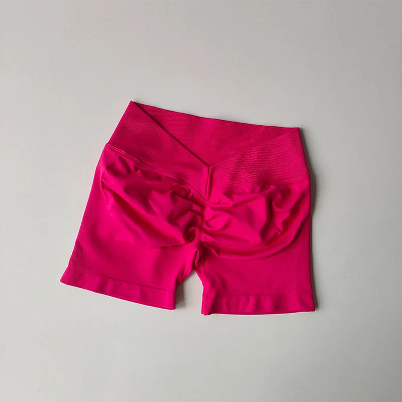 KiKis seamless yoga suit for women in bright pink with high waist and ruched back design