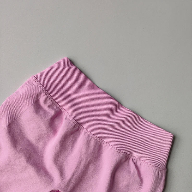 Close-up of pink ribbed waistband on seamless yoga suit for women by KiKis