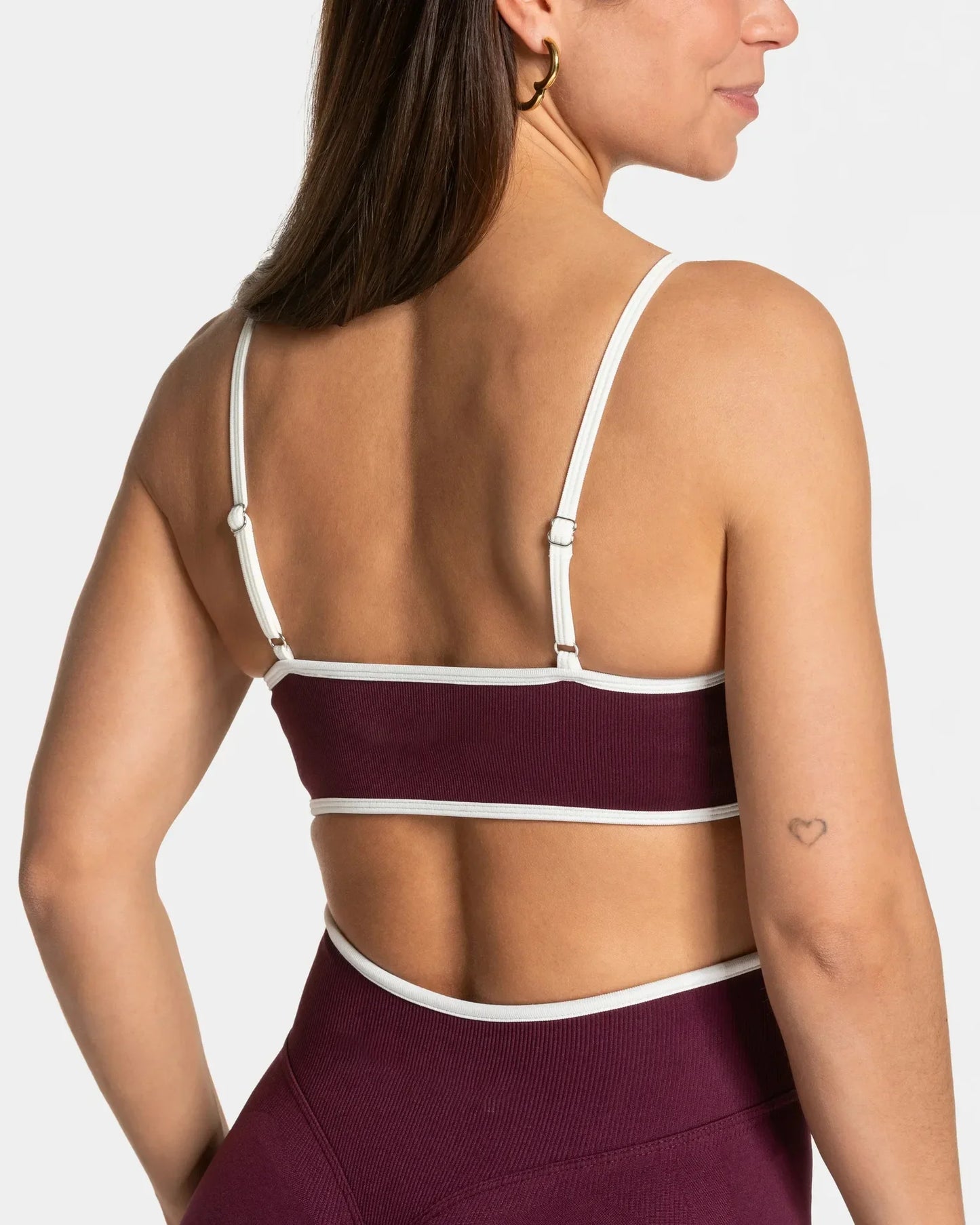 KiKis shockproof yoga bra outdoor fitness in burgundy with white straps shown from the back