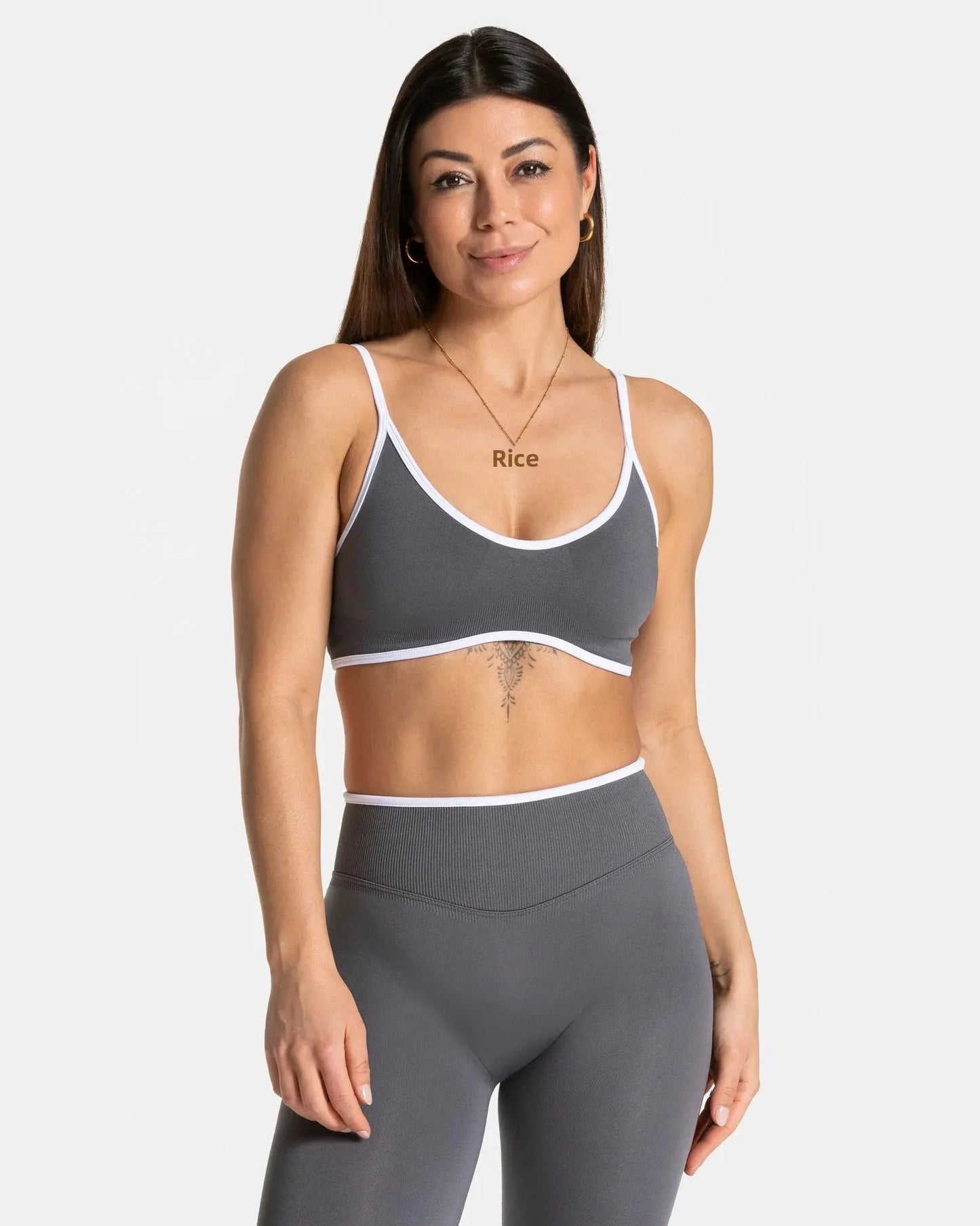 KiKis shockproof yoga bra outdoor fitness in gray with white trim worn by woman