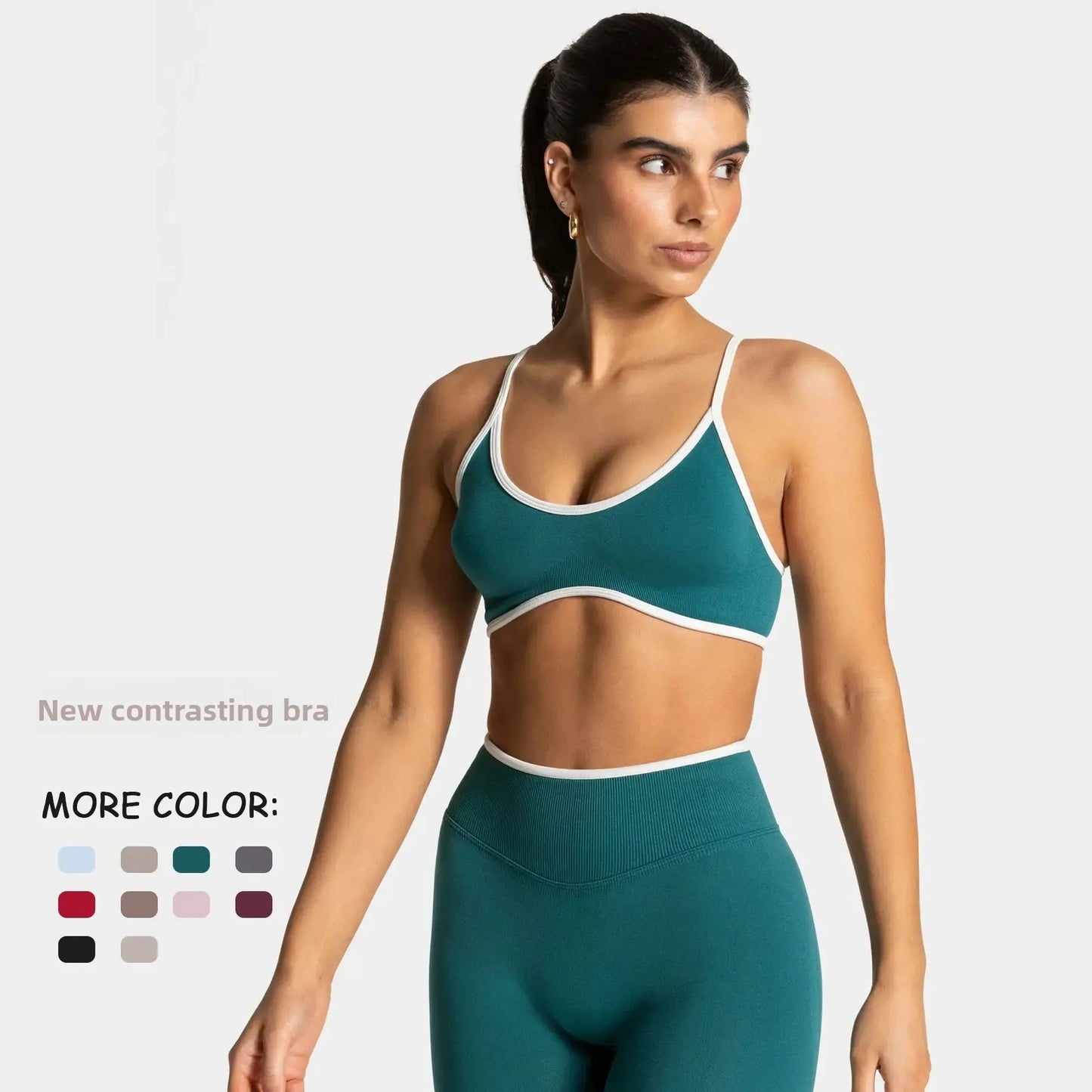 KiKis shockproof yoga bra outdoor fitness in teal with white trim modeled by woman in matching leggings
