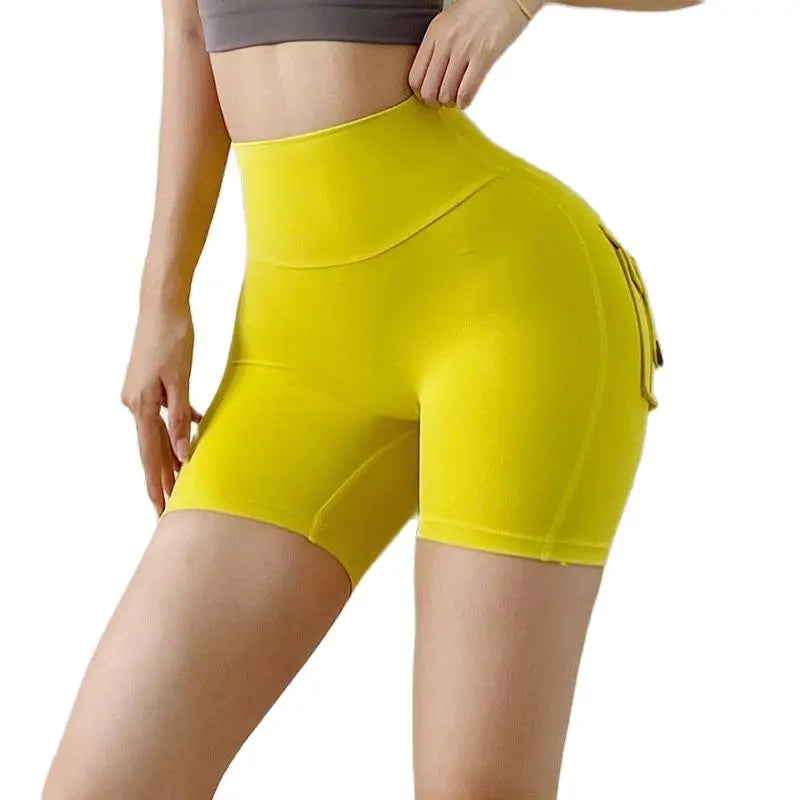 KiKis high waisted cycling shorts women in bright yellow with side pocket and fitted design