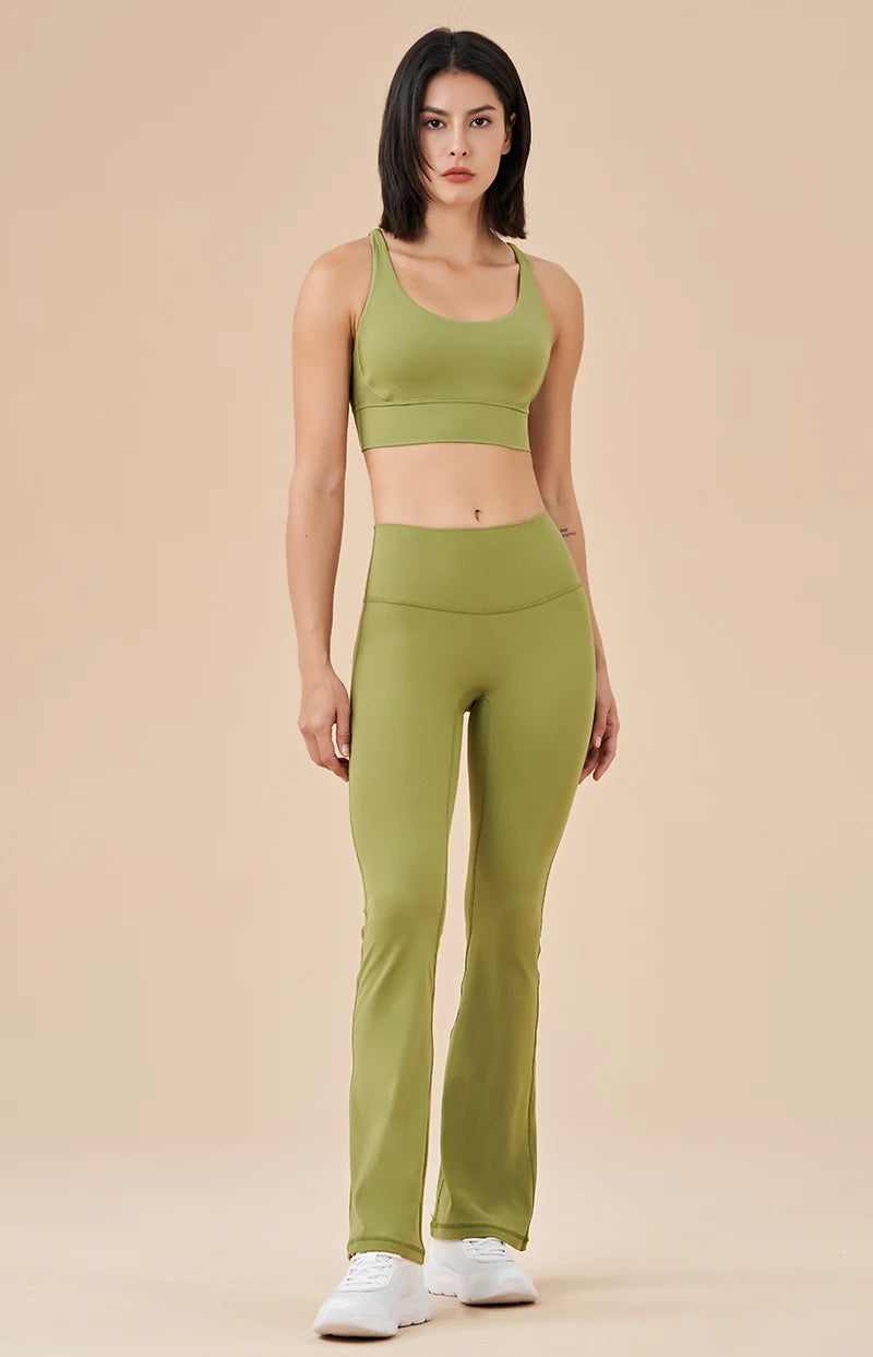 KiKis womens bell bottom yoga pants in olive green paired with matching sports bra