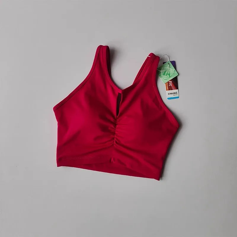 KiKis red women's push up sports bra with ruched front detail and sleeveless design