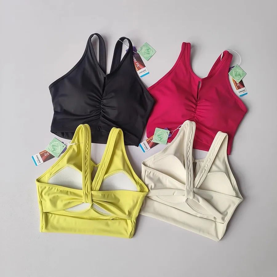 KiKis women's push up sports bra set in black pink yellow and cream with racerback design