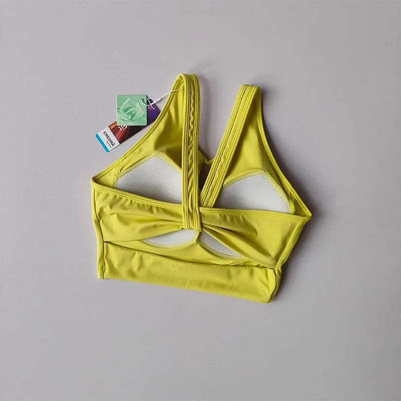 KiKis yellow women's push up sports bra with racerback design and breathable lining