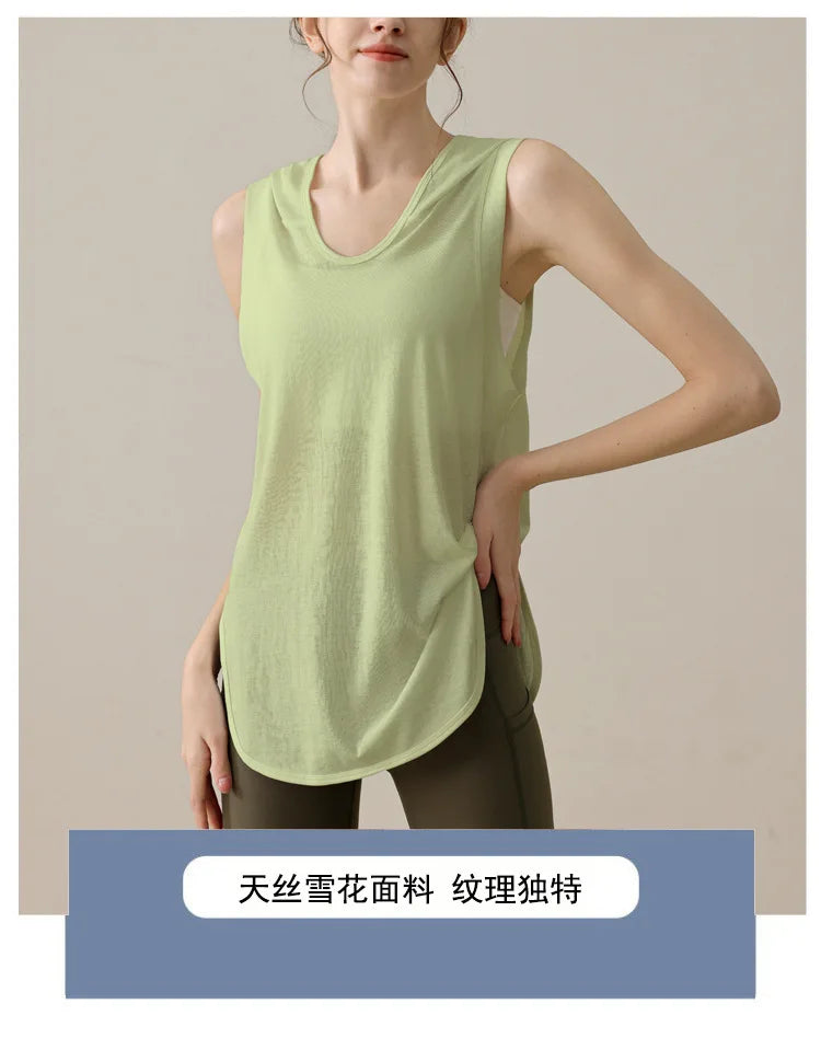 KiKis light green summer sleeveless workout hoodie worn by a woman with side pockets