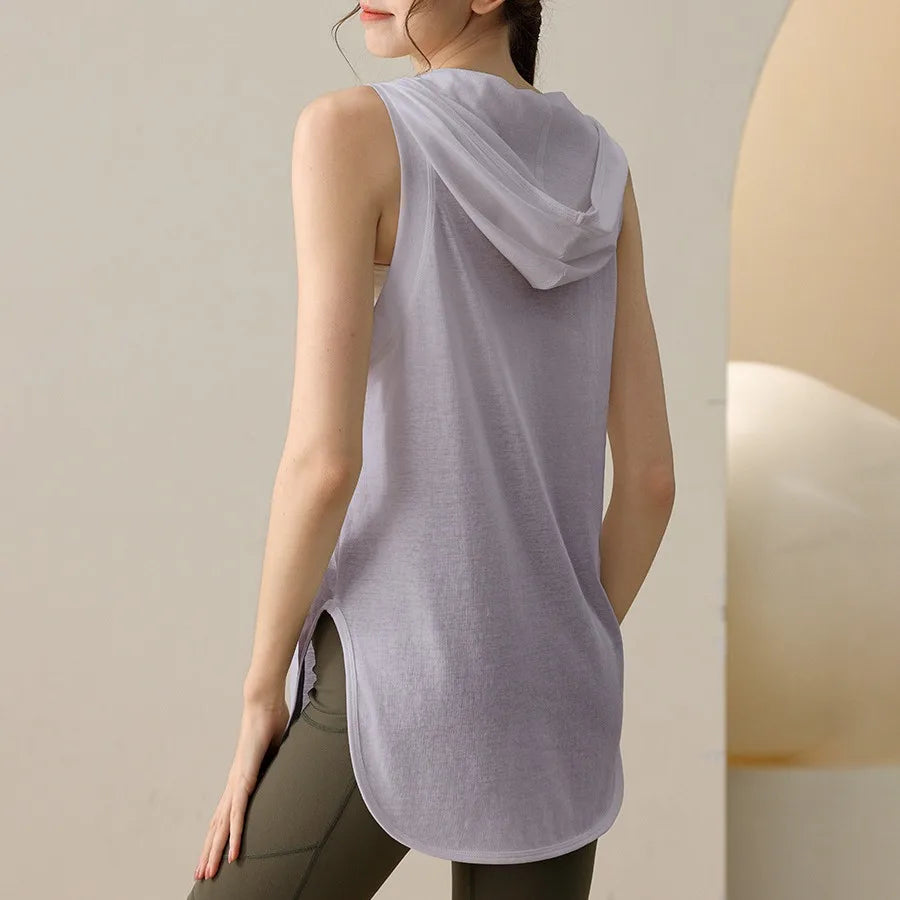 KiKis light purple summer sleeveless workout hoodie worn by a woman with green leggings